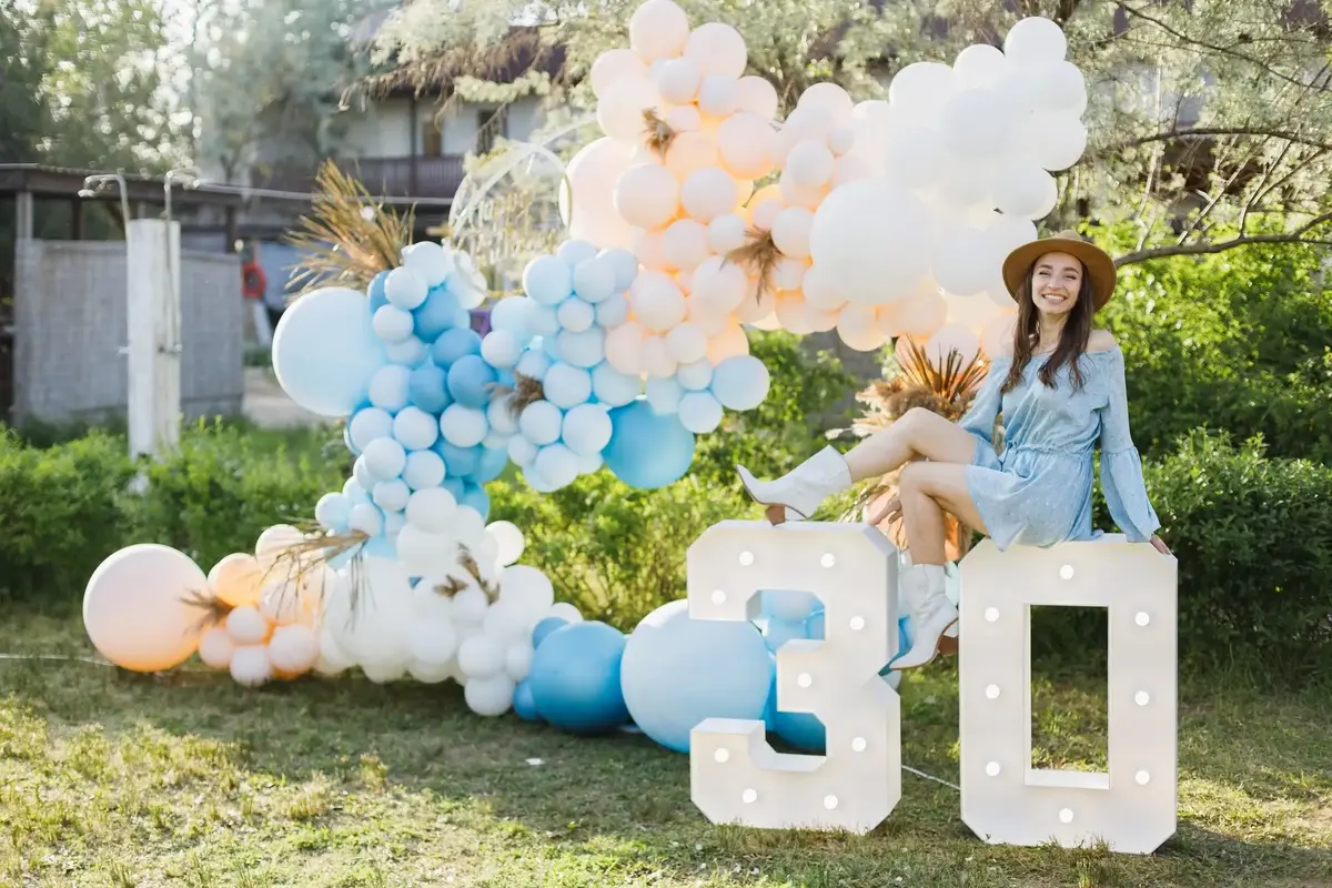 Outdoor balloon decoration setup for a birthday celebration